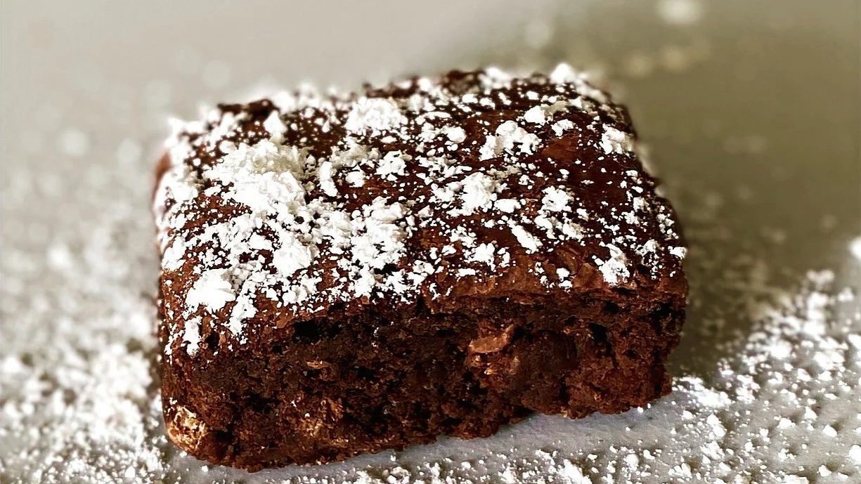 The OG brownie powdered sugar on fudge brownie Ditch The Mix Columbus Ohio